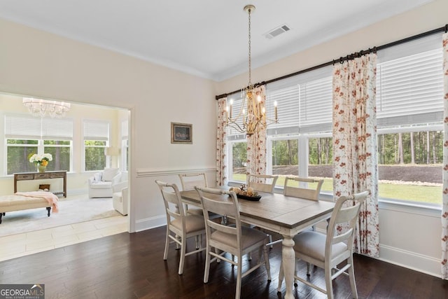 1413 N Walkers Mill Rd, Griffin, GA 30223 - dining space with a chandelier, plenty of natural light, dark wood-style flooring, and ornamental molding