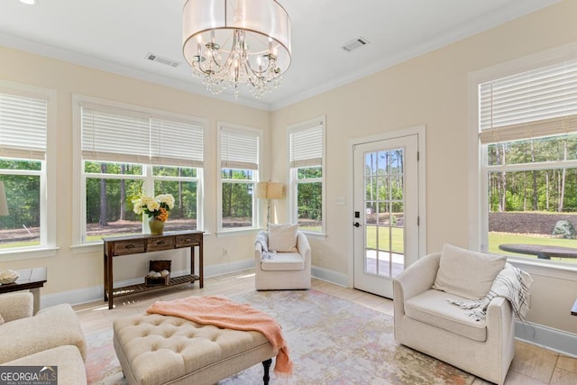 1413 N Walkers Mill Rd, Griffin, GA 30223 - living area featuring plenty of natural light, crown molding, and a chandelier
