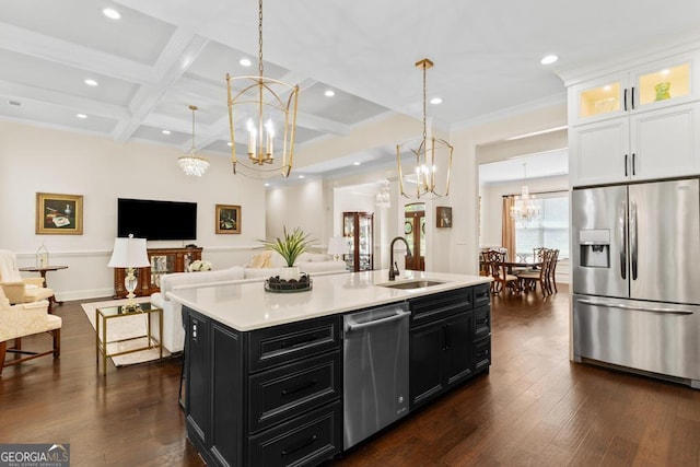 1413 N Walkers Mill Rd, Griffin, GA 30223 - kitchen with appliances with stainless steel finishes, dark cabinetry, a chandelier, open floor plan, and white cabinetry