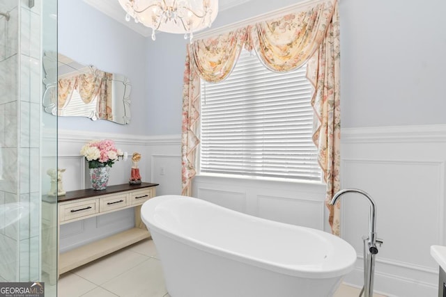 1413 N Walkers Mill Rd, Griffin, GA 30223 - full bathroom featuring a chandelier, a wainscoted wall, healthy amount of natural light, a soaking tub, and a decorative wall
