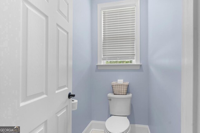 1413 N Walkers Mill Rd, Griffin, GA 30223 - bathroom with baseboards and toilet