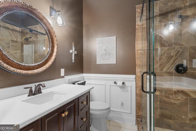 1413 N Walkers Mill Rd, Griffin, GA 30223 - bathroom featuring a decorative wall, vanity, a stall shower, and a wainscoted wall