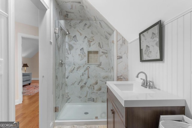 1413 N Walkers Mill Rd, Griffin, GA 30223 - bathroom with a marble finish shower, vanity, and wood finished floors