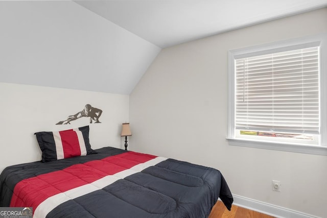 1413 N Walkers Mill Rd, Griffin, GA 30223 - bedroom featuring lofted ceiling and wood finished floors