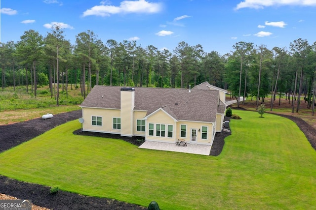 1413 N Walkers Mill Rd, Griffin, GA 30223 - back of house featuring a patio, a yard, a chimney, and a shingled roof