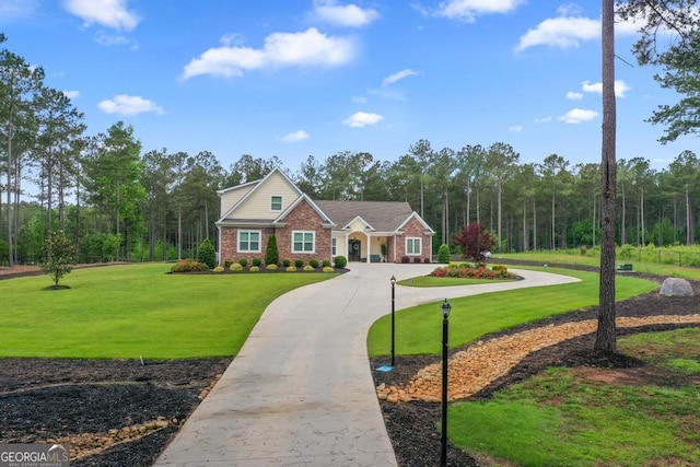 1413 N Walkers Mill Rd, Griffin, GA 30223 - view of front of house featuring curved driveway, brick siding, and a front lawn