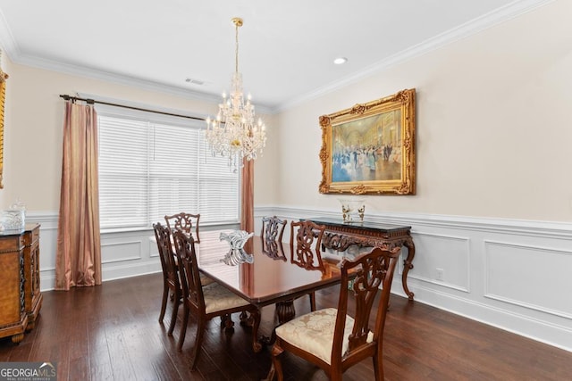 1413 N Walkers Mill Rd, Griffin, GA 30223 - dining area with a chandelier, dark wood finished floors, ornamental molding, wainscoting, and a decorative wall