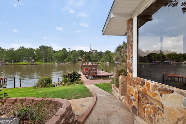 106 Oak Ln, Eatonton, GA 31024 - dock area with a water view, a lawn, and view of wooded area