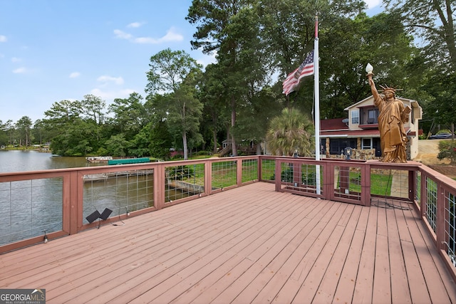 106 Oak Ln, Eatonton, GA 31024 - wooden terrace featuring a water view, view of wooded area, and a boat dock