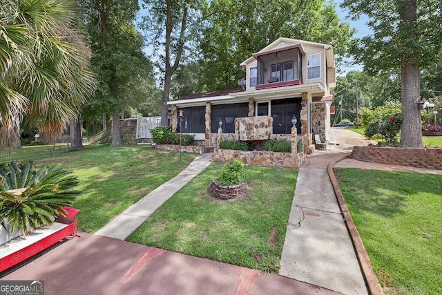 106 Oak Ln, Eatonton, GA 31024 - view of front of home featuring a sunroom and stone siding
