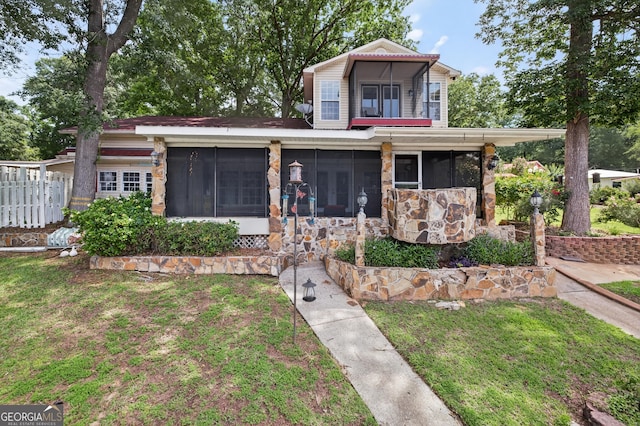 106 Oak Ln, Eatonton, GA 31024 - view of front of house with a sunroom and stone siding