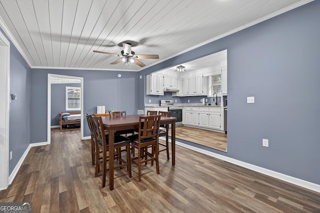 106 Oak Ln, Eatonton, GA 31024 - dining area with crown molding, ceiling fan, dark wood-type flooring, and plenty of natural light