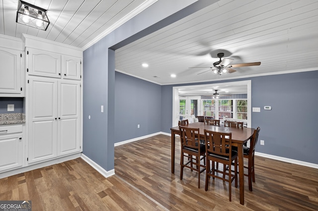 106 Oak Ln, Eatonton, GA 31024 - dining room with ceiling fan, crown molding, dark wood-style flooring, and wooden ceiling