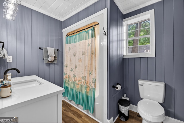 106 Oak Ln, Eatonton, GA 31024 - full bath with crown molding, wood finished floors, vanity, a shower with curtain, and wooden walls