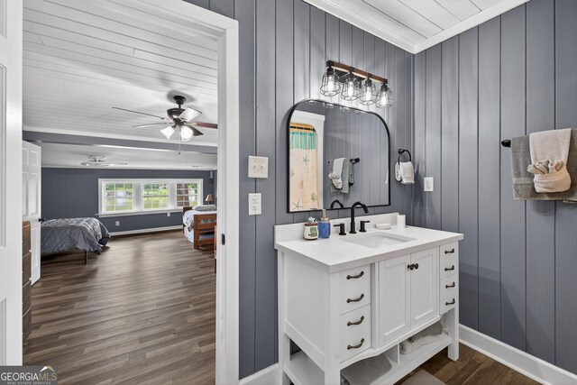 106 Oak Ln, Eatonton, GA 31024 - bathroom featuring ensuite bathroom, vanity, wood finished floors, a ceiling fan, and crown molding