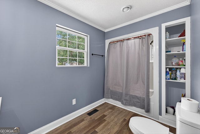 106 Oak Ln, Eatonton, GA 31024 - bathroom featuring wood finished floors, ornamental molding, a textured ceiling, and shower / bathtub combination with curtain