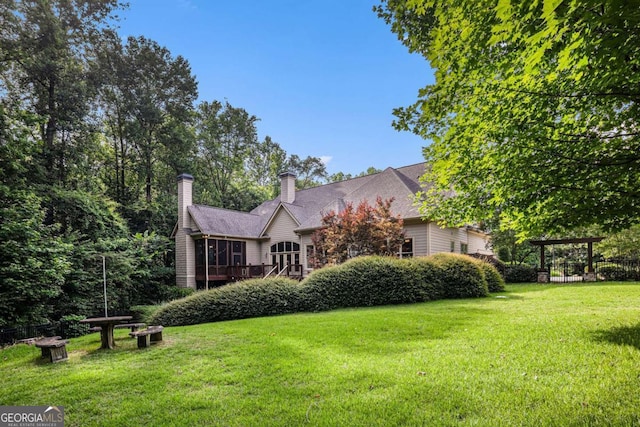 287 Scenic Falls Blvd, Hoschton, GA 30548 - view of front of property featuring a front yard and a chimney