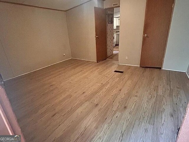 1004 Gordon Ave, Mcrae-Helena, GA 31037 - unfurnished bedroom featuring wood finished floors