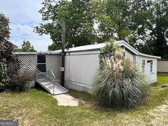 1004 Gordon Ave, Mcrae-Helena, GA 31037 - view of home's exterior with a lawn