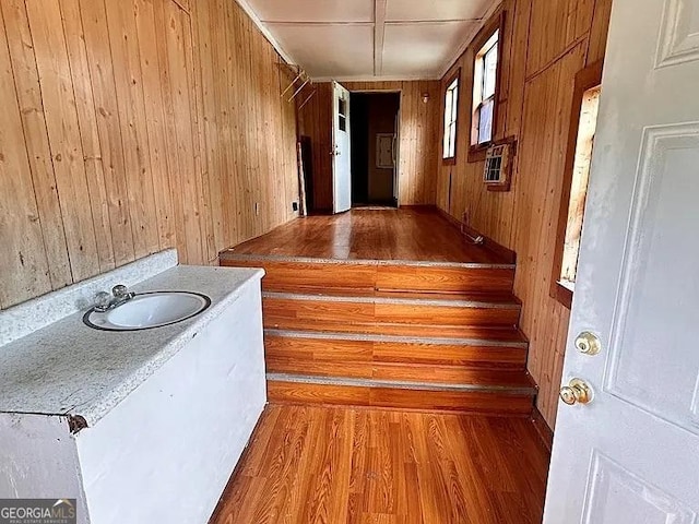 1004 Gordon Ave, Mcrae-Helena, GA 31037 - hall featuring wooden walls, wood finished floors, and heating unit