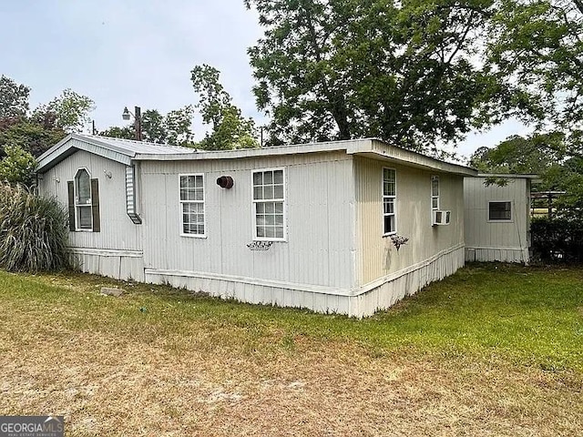 1004 Gordon Ave, Mcrae-Helena, GA 31037 - view of home's exterior featuring a yard and cooling unit