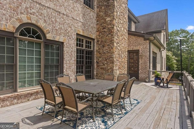 7945 Reinhardt College Pkwy, Waleska, GA 30183 - wooden deck with outdoor dining area