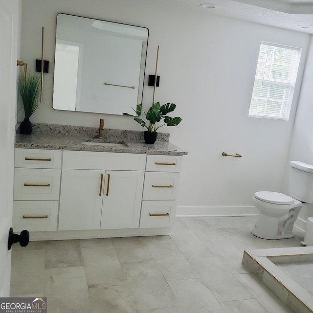 503 S Dooly St, Montezuma, GA 31063 - bathroom with toilet and vanity
