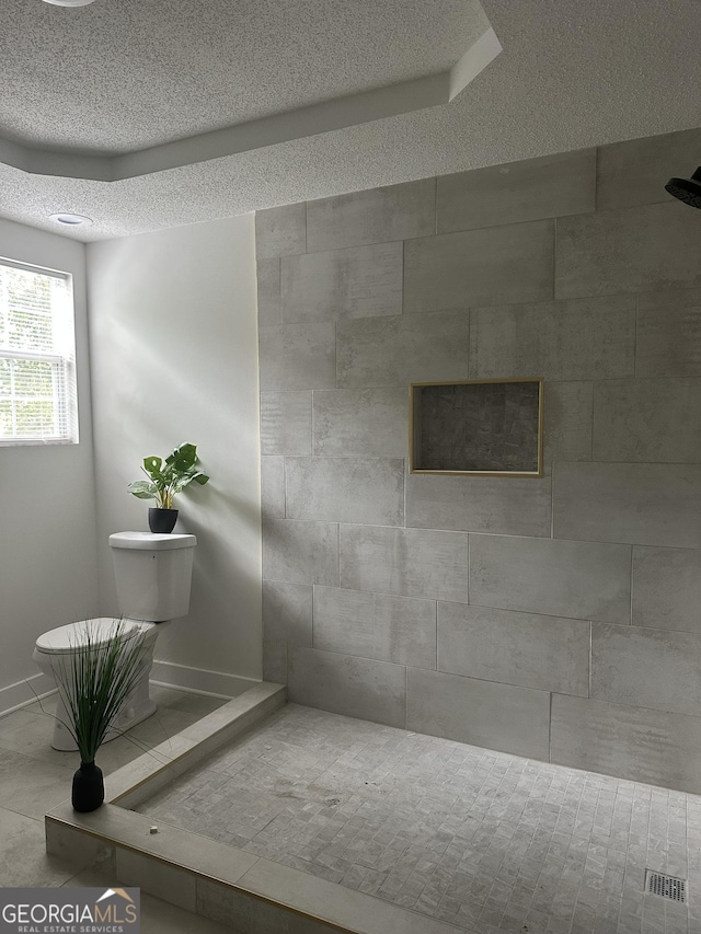 503 S Dooly St, Montezuma, GA 31063 - bathroom featuring baseboards and tiled shower