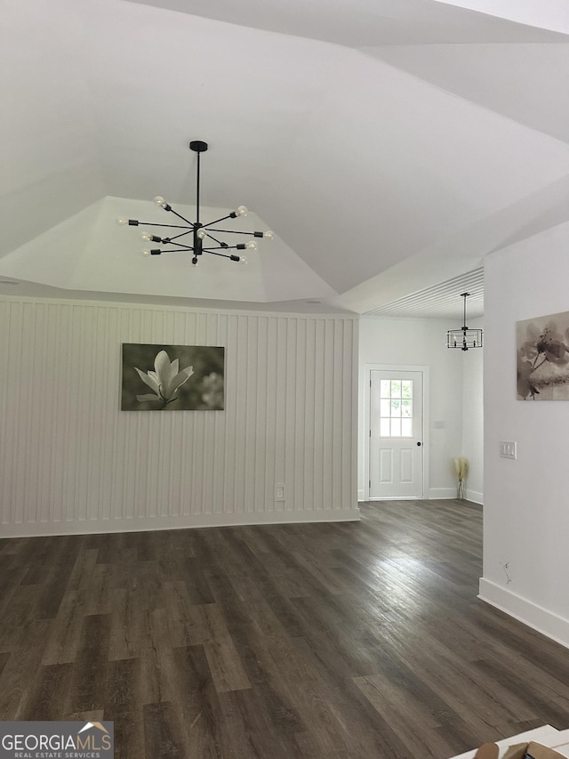503 S Dooly St, Montezuma, GA 31063 - unfurnished living room with a chandelier, dark wood-style flooring, and vaulted ceiling