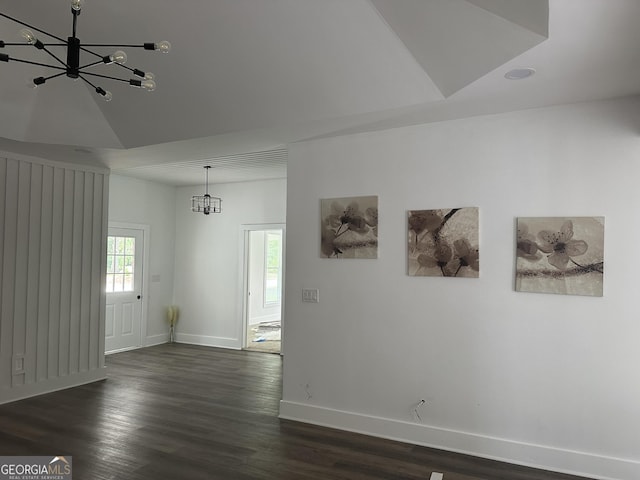 503 S Dooly St, Montezuma, GA 31063 - unfurnished room featuring a chandelier, dark wood finished floors, and vaulted ceiling