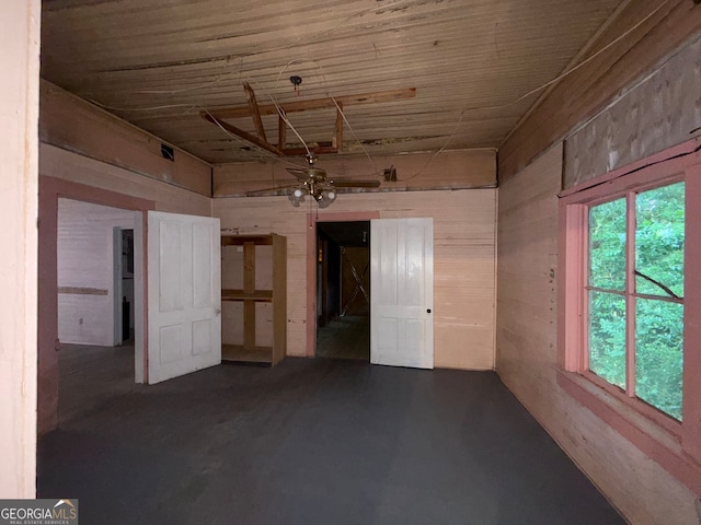 104 W Mauldin St, Walhalla, SC 29691 - empty room with wood walls, finished concrete floors, and wooden ceiling