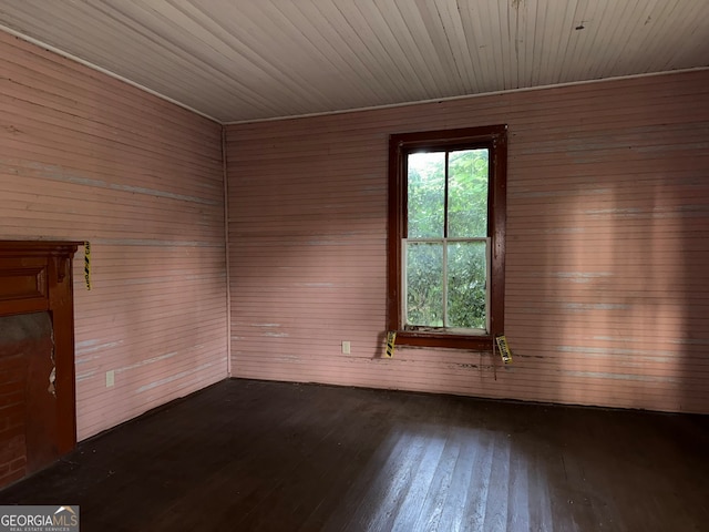 104 W Mauldin St, Walhalla, SC 29691 - spare room with dark wood-type flooring, wood walls, and wood ceiling
