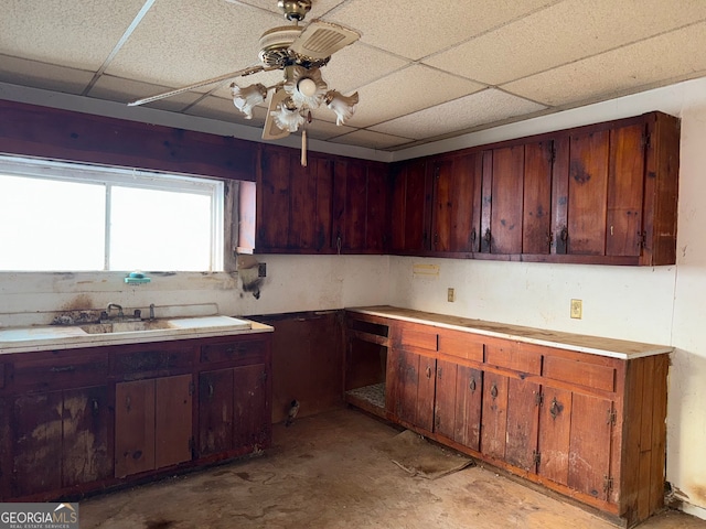 104 W Mauldin St, Walhalla, SC 29691 - kitchen with a paneled ceiling, concrete floors, a ceiling fan, and light countertops