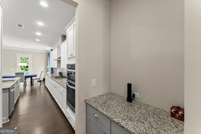 4130 Millbrook Ct, Suwanee, GA 30024 - kitchen with appliances with stainless steel finishes, dark wood finished floors, ornamental molding, recessed lighting, and light stone countertops