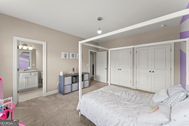 4130 Millbrook Ct, Suwanee, GA 30024 - bedroom with multiple closets, light carpet, and connected bathroom