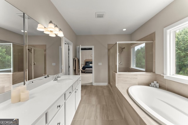 4130 Millbrook Ct, Suwanee, GA 30024 - ensuite bathroom with vanity, a shower stall, a bath, and healthy amount of natural light