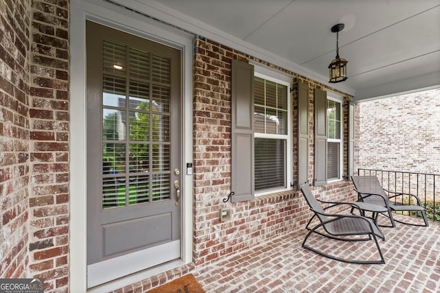 4130 Millbrook Ct, Suwanee, GA 30024 - property entrance with a porch and brick siding