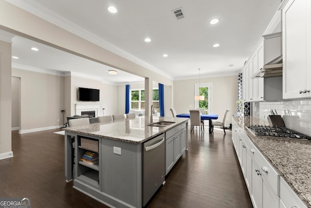 4130 Millbrook Ct, Suwanee, GA 30024 - kitchen with appliances with stainless steel finishes, an island with sink, dark wood-style floors, recessed lighting, and tasteful backsplash