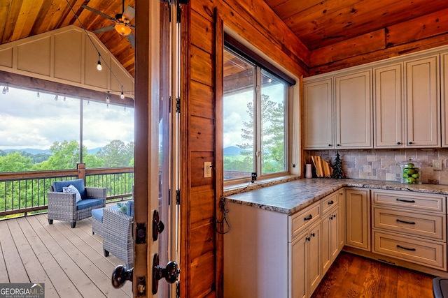 899 Ridge Pointe Way, Blairsville, GA 30512 - kitchen featuring vaulted ceiling, wood ceiling, decorative backsplash, dark wood finished floors, and light stone countertops
