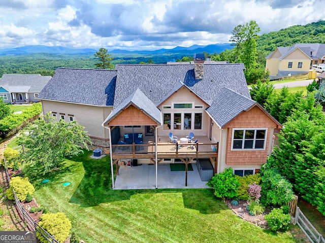 899 Ridge Pointe Way, Blairsville, GA 30512 - rear view of property with a patio area, a shingled roof, a lawn, a deck with mountain view, and a chimney