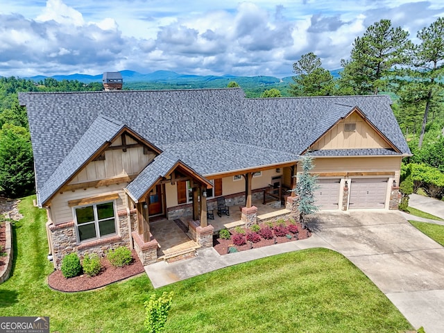 899 Ridge Pointe Way, Blairsville, GA 30512 - view of front of house featuring stone siding, roof with shingles, covered porch, board and batten siding, and a front lawn