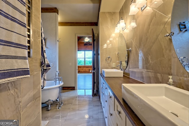 899 Ridge Pointe Way, Blairsville, GA 30512 - bathroom with double vanity, a freestanding tub, marble finish flooring, and tile walls