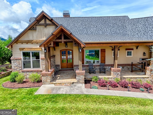 899 Ridge Pointe Way, Blairsville, GA 30512 - view of front facade with french doors, roof with shingles, a chimney, stone siding, and board and batten siding
