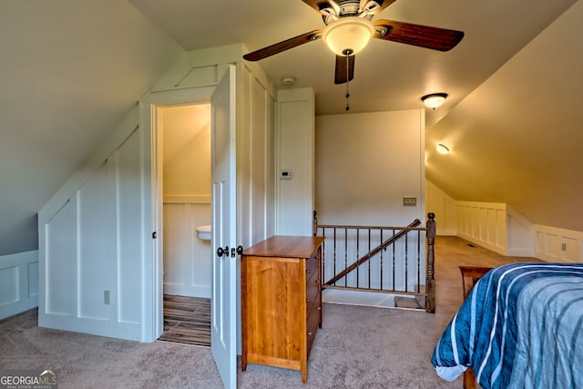 899 Ridge Pointe Way, Blairsville, GA 30512 - carpeted bedroom featuring a decorative wall, lofted ceiling, wainscoting, and a ceiling fan