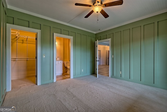 899 Ridge Pointe Way, Blairsville, GA 30512 - unfurnished bedroom with a spacious closet, carpet, a decorative wall, connected bathroom, and a closet