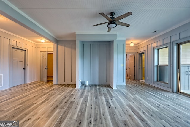 899 Ridge Pointe Way, Blairsville, GA 30512 - unfurnished bedroom with light wood-style floors, a decorative wall, and crown molding