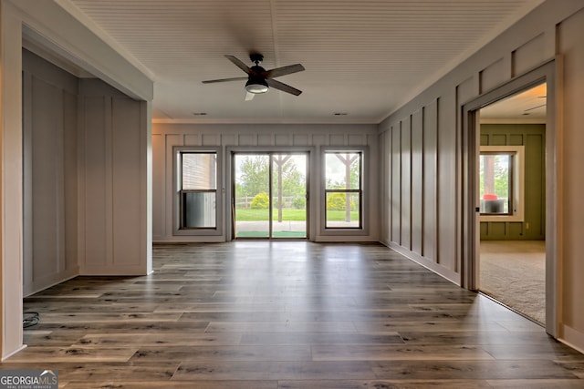 899 Ridge Pointe Way, Blairsville, GA 30512 - empty room featuring a decorative wall, a ceiling fan, wood finished floors, and ornamental molding