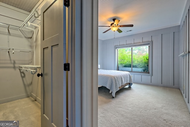 899 Ridge Pointe Way, Blairsville, GA 30512 - bedroom featuring carpet flooring, a ceiling fan, and a decorative wall