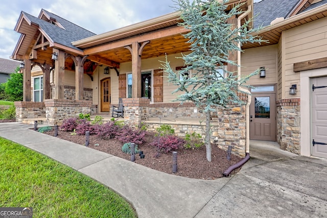 899 Ridge Pointe Way, Blairsville, GA 30512 - doorway to property with covered porch, roof with shingles, and stone siding