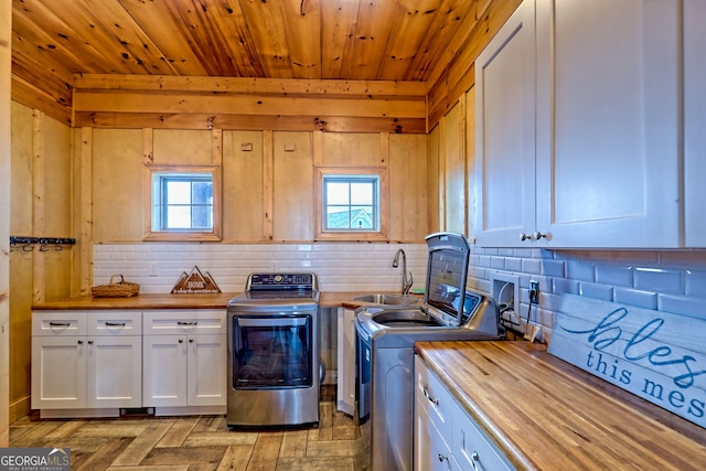 899 Ridge Pointe Way, Blairsville, GA 30512 - washroom featuring cabinet space, plenty of natural light, washing machine and clothes dryer, and wood ceiling